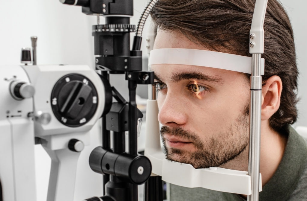 Man undergoing eye exam at optometrist office
